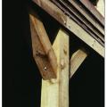 Knee braces do not stiffen a pile foundation as much as diagonal bracing, but they present less obstruction to waves and debris, are less prone to compression buckling, and may be designed for both tension and compression loads. 