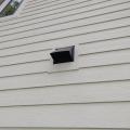 Right - This kitchen exhaust duct termination is integrated aesthetically and functionally with the exterior cladding. 
