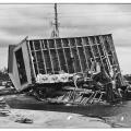 Continuous load path failure due to improper connections between a home and its foundation allowed this building to be overturned in hurricane force winds.