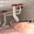 Right - The service penetrations through the structural slab in this garage plenum are air sealed. 