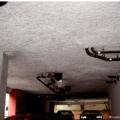 Thermally isolate heated garages in multifamily buildings from ambient space, and thermally isolate all garages in multifamily buildings from interior occupied space. This parking garage is thermally isolated from space above with spray foam insulation.
