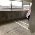 This shared parking garage in a multistory multifamily building is open to the exterior, allowing for natural air changes to control airborne contaminant concentration.