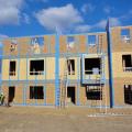 All of the sheathing seams and joints in the exterior walls of this multifamily building are air sealed with tape including the seams at the party wall interfaces