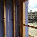 Wrong - Membrane or sealant air seal is missing at the intersection of the party wall with the exterior wall in this multifamily building 