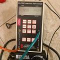 This manometer is set up to show whole house air leakage with reference to the outside during a blower door test; the reading is showing 1,434 cfm of leakage when the home is depressurized to about 50 Pascals. 