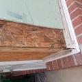 Wrong - Metal flashing is bent and poorly installed and tape flashing is missing.
