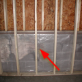 Wrong - Class I vapor retarder over framed basement walls can cause condensation, mold, and rotting because plastic prevents drying to the inside; the outside should have waterproofing and vertical drainage, and the framing should be spaced from the wall.