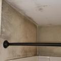 Wrong - Poor ventilation has encouraged the build up of mold in this shower.