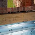 Wrong - Mortar is clogging 1" drainage gap behind brick wall.