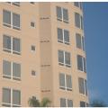 The individual exhaust systems for each dwelling unit in this multifamily building result in large numbers of penetrations in the exterior façade 