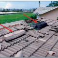 Wrong – The off-ridge roof vent on the right was poorly anchored and pulled off in high winds allowing water into the home. 
