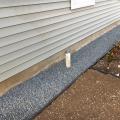 Pea gravel provides a pest-resistant perimeter around the foundation 
