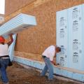When rigid foam insulation is applied to the exterior side of the wall cavity under the cladding, with seams taped and an air gap provided, it acts as a vapor barrier, air barrier, and rain screen.