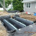 A storm water management system channels rainwater to retention chambers buried in the front yard.