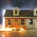 In this IBHS Research Center test of two homes exposed to flying embers and high winds, the home with wood siding and a wood door went up in flames, the home with fiber cement siding and a metal door suffered little damage.