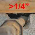 Wrong - This plumbing penetration through the foundation wall has not been sealed; the seam between the sill plate and the foundation wall is also unsealed