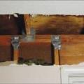 Add metal connectors to strengthen framing connections in an existing wall from inside the home by removing drywall. 