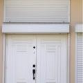 Right – This exterior door is installed to swing out and has storm protection shutters