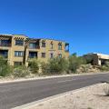 Right – the building on the right employs light-colored walls, deep tinting, and deeply recessed windows to minimize solar heat gain