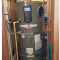Right: This heat pump water heater is in a basement within the thermal boundary but not actively conditioned. It has over 770 ft² of space with easy access to the control panel and clearance for airflow to the air intake (top) and exhaust (side)