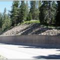 Riprap erosion protection placed on the cut slope above the retaining wall