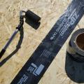 Right - Seam-sealing flashing tape is installed with roller to fully adhere to the OSB.