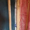Wrong - No insulation was installed behind the shower surround.