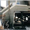 The rails on these stairs were enclosed with siding, presenting a greater obstacle to the flow of flood water and contributing to the flood damage shown here. 
