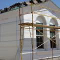Expanded polystyrene insulation is installed with joints taped and lath attached in preparation for the application of stucco