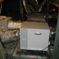 A supplemental dehumidifier is integrated with the home’s HVAC air handler to provide extra dehumidification when needed