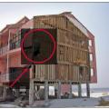 This synthetic stucco (EIFS) siding which was installed over EPS that was adhered to gypsum board failed in high winds when the gypsum board pulled over the fasteners that mechanically attached it to the studs.