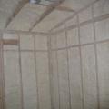 Spray foam insulation is installed in open wall cavities to air seal and insulate