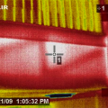 Wrong - This IR image of a second-floor landing shows that attic air is flowing far into the interstitial floor cavity of the second-floor landing
