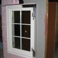 Two layers of XPS are installed with staggered seams over a liquid-applied membrane on the structural sheathing