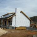 Two layers of high-permeability house wrap are installed to provide a drainage layer between the SIPS and the homes external cladding