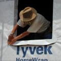 After installing the house wrap over the SIPS, window flashing is installed