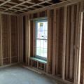 Right - Double-stud wall are boxed with plywood around windows and doors