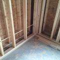 Right – A gap separates the two wall layers in this double-stud wall assembly allowing room for insulation to stop thermal bridging between the inner and outer wall