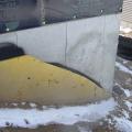 Exterior fiberglass insulation on this new home was (incorrectly) cut to terminate below-grade after backfill, which will expose the above-grade portions of the foundation wall to cold temperatures