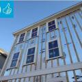 Right - Foil-faced polyisocyanurate rigid foam is attached to the existing exterior wall with vertical wood furring strips