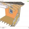 Deep energy retrofit showing insulation sprayed on exterior of walls over existing siding
