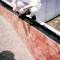 Rigid insulation is installed on the exterior side of the flat foundation wall