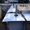 Termite shield is installed at the top of the foundation wall before installing sill plates; all seams and holes are sealed with epoxy