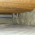 Right - Spray foam insulates and air-seals the stone walls of this unvented crawlspace.