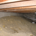 Wrong - The ground of the crawlspace should be covered with a vapor barrier that extends up the sides of the crawlspace. 