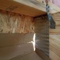 Wrong - Toe nails in roof truss are set too low in framing bracket and hurricane strap is set too high so lower nails don't hit lower 2x6 of top plate.