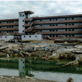 This reinforced concrete apartment building with exterior roof access in Minamisanriku, Japan, was designated as a vertical evacuation refuge during tsunamis; 44 people survived the 2011 Tohoku tsunami on the fenced roof