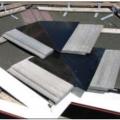 Right - Pieces of metal flashing are installed under each tile course along the valley centerline to prevent debris accumulation between and below concrete roof tiles.