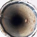 Wrong - Vent hole has no cover or screening and is poorly sealed and flashed to siding.