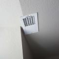 Wrong - Ceiling HVAC register is improperly installed on an angled ceiling.